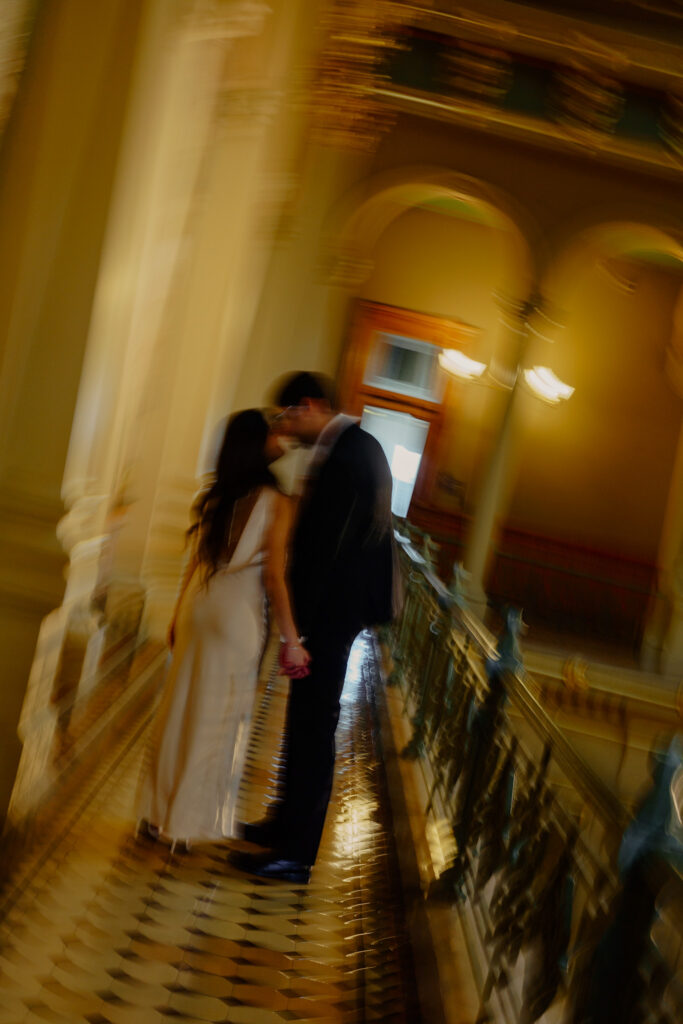 Iowa capitol elopement - blurry action shot couple kissing