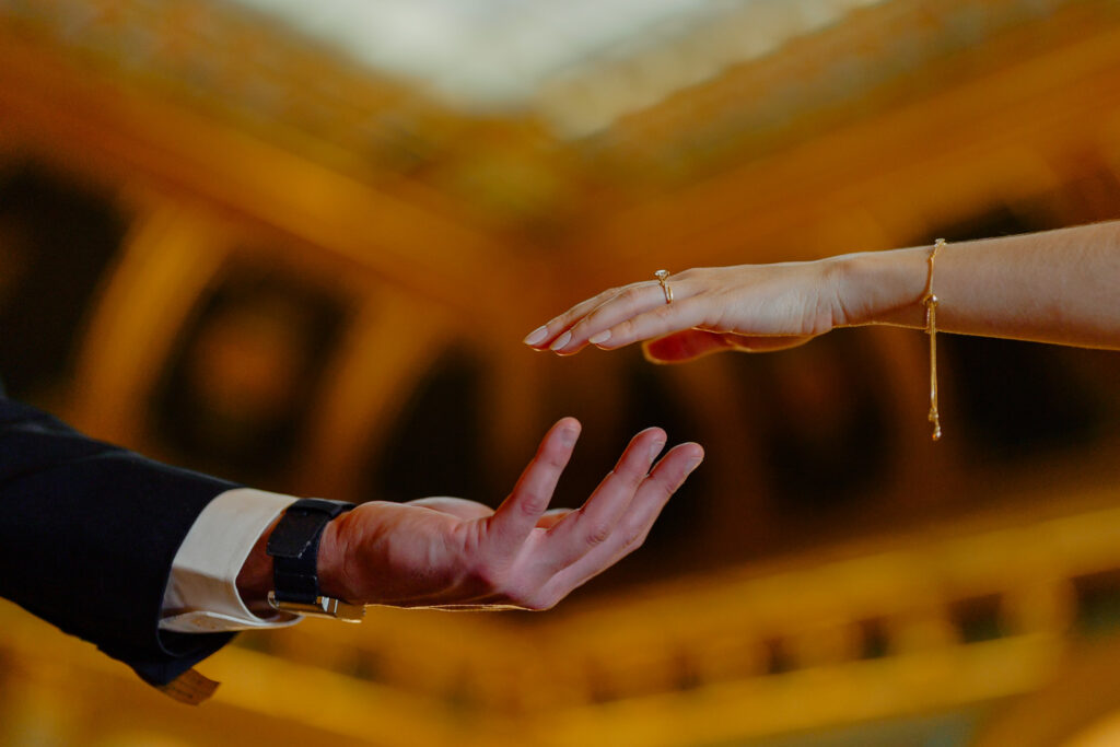 Iowa capitol elopement - bride and groom reaching their hands out