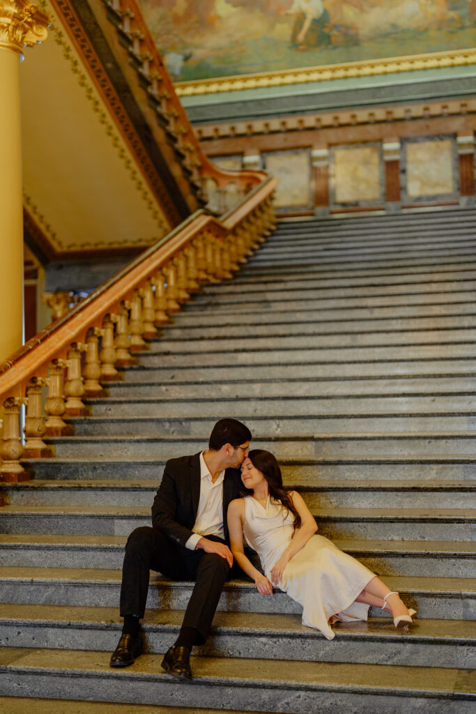 Iowa capitol elopement - couple sitting on stairs