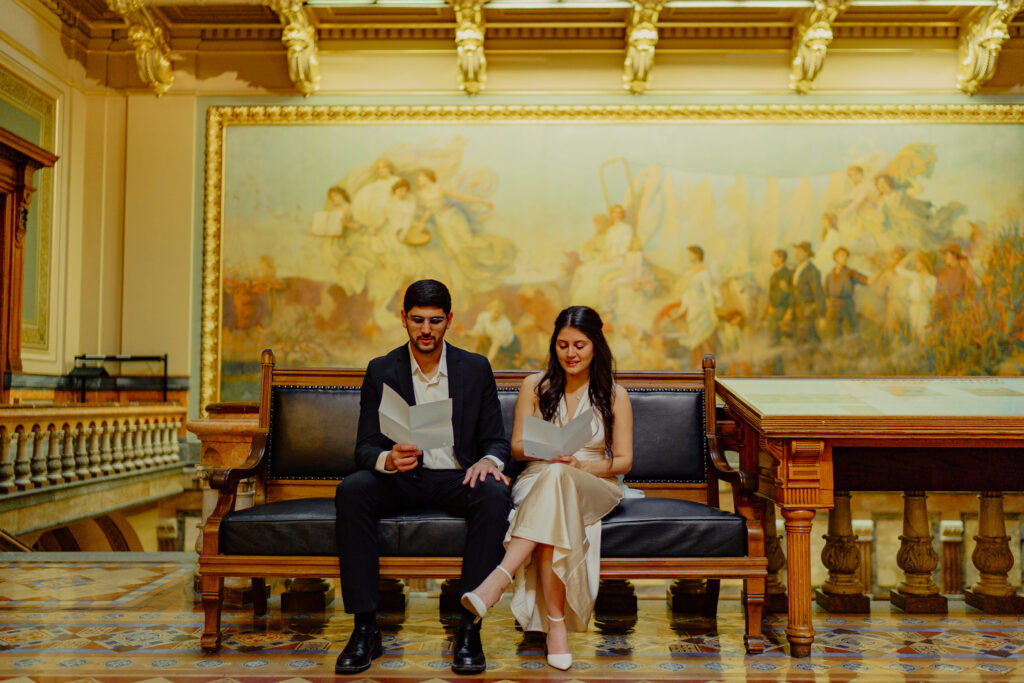Iowa capitol elopement - couple reading vows