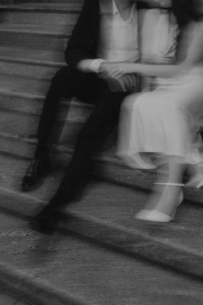 Iowa capitol elopement - couple sitting on stairs