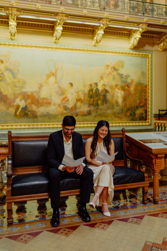 Iowa capitol elopement - couple reading vows