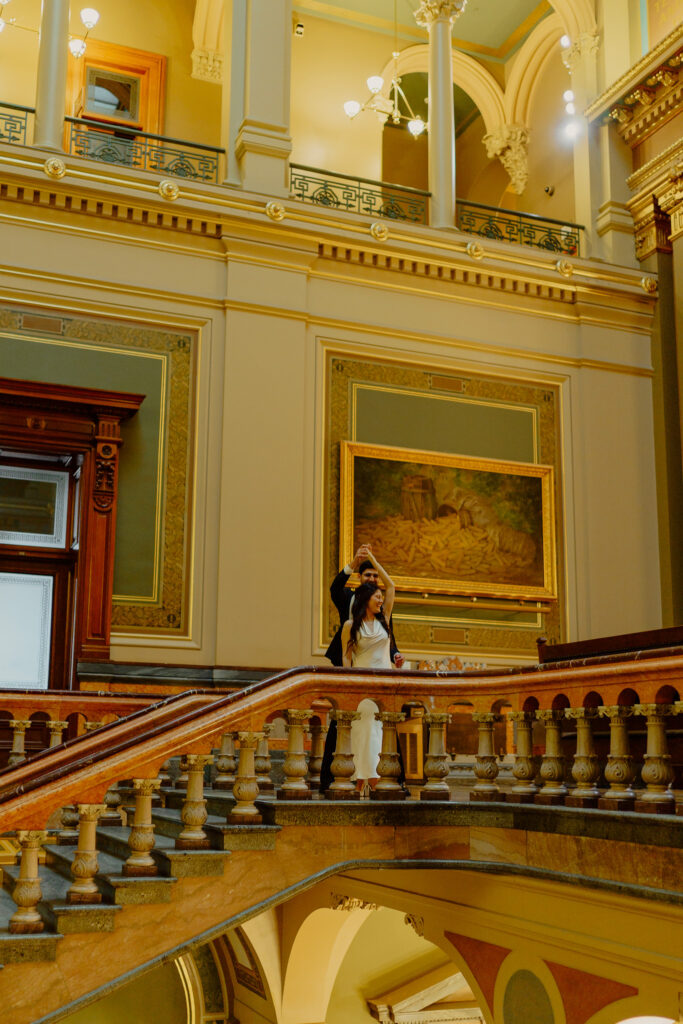 Iowa capitol elopement - groom spinning bride