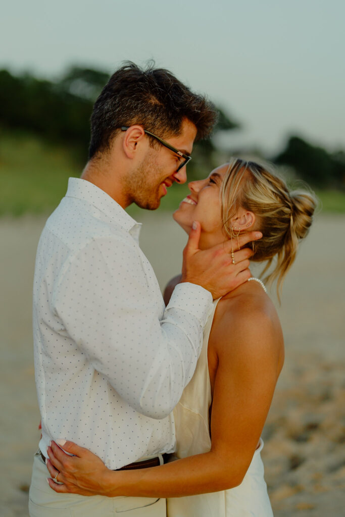 Couple in warm embrace smiling at each other