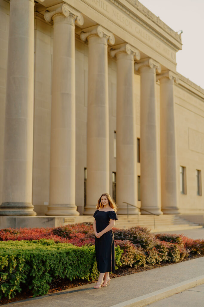 Professional business headshot of woman at Nelson-Atkins Museum in Kansas City wide shot with columns and woman at center smiling