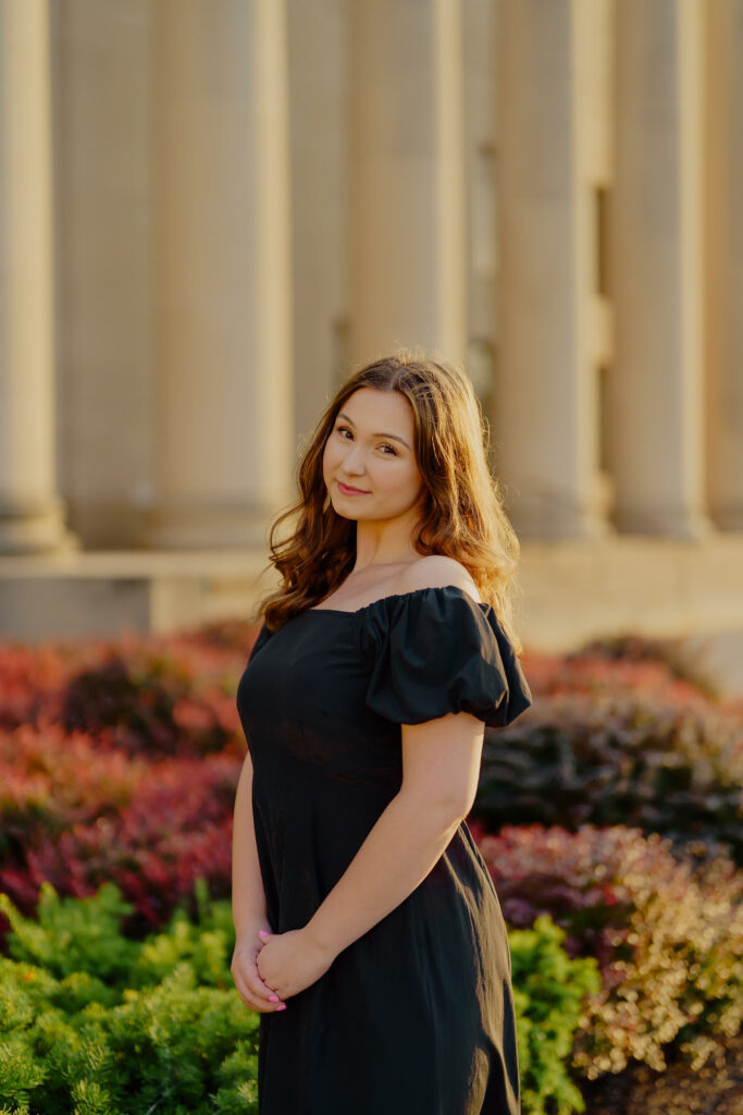 Professional business headshot of woman at Nelson-Atkins Museum in Kansas City soft smiling at camera