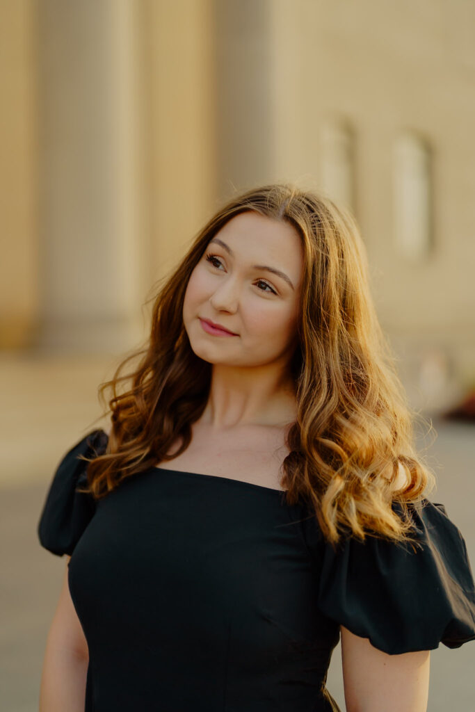 Professional business headshot of woman at Nelson-Atkins Museum in Kansas City soft smiling