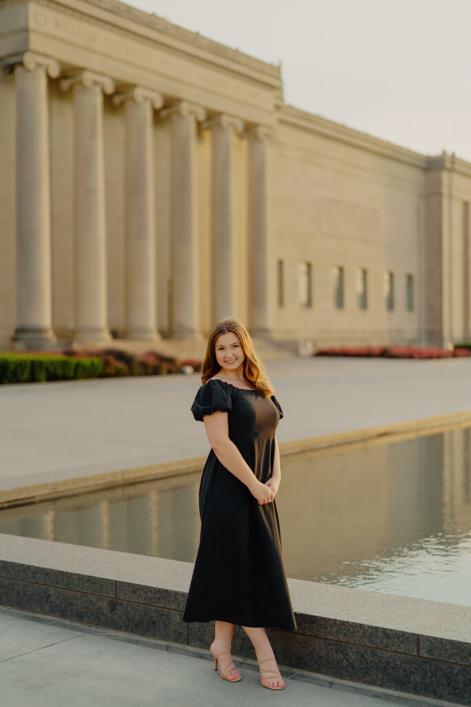 Modern Kansas City business headshots with waterfront backdrop at Nelson-Atkins classic woman smiling at camera