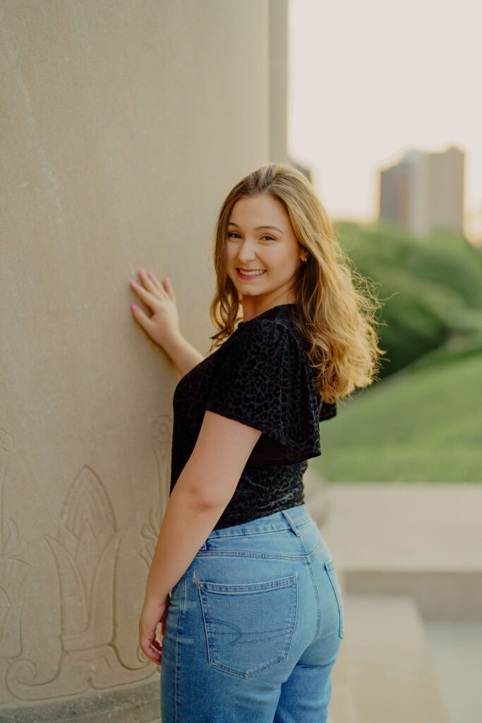 Confident professional headshot with architectural backdrop at Nelson-Atkins Museum striking pose
