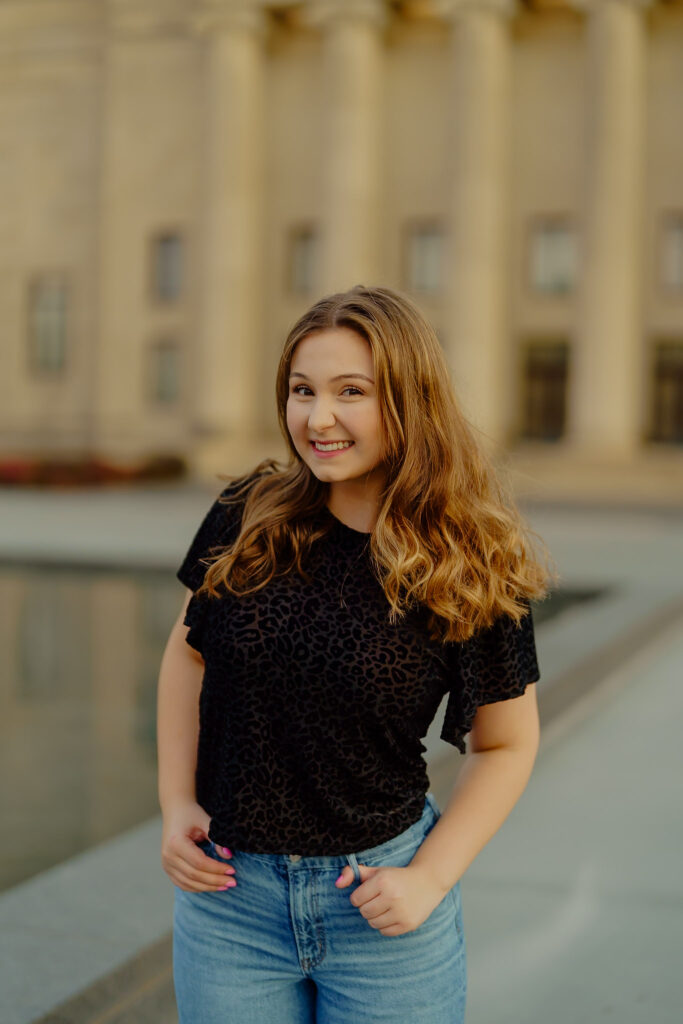 Corporate portrait of woman smiling in natural light at Nelson-Atkins Museum