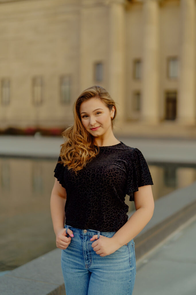 Corporate portrait of woman soft smiling in natural light at Nelson-Atkins Museum