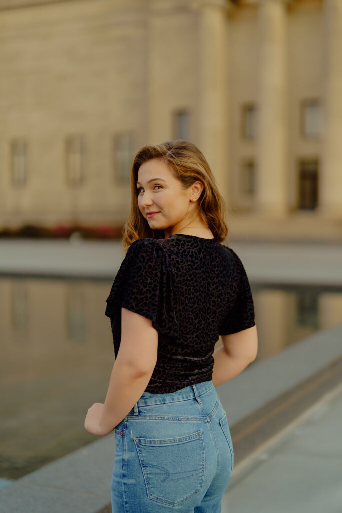 Confident professional headshot with architectural backdrop at Nelson-Atkins Museum