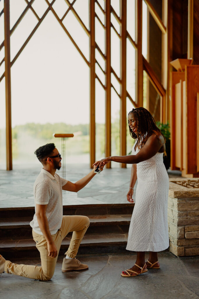 Romantic Powell Gardens chapel proposal in Missouri, woman happy and shocked