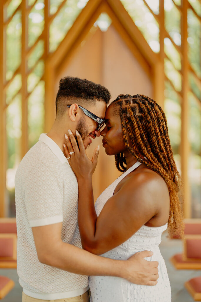 Romantic Powell Gardens proposal in Missouri couple in warm embrace facing each other