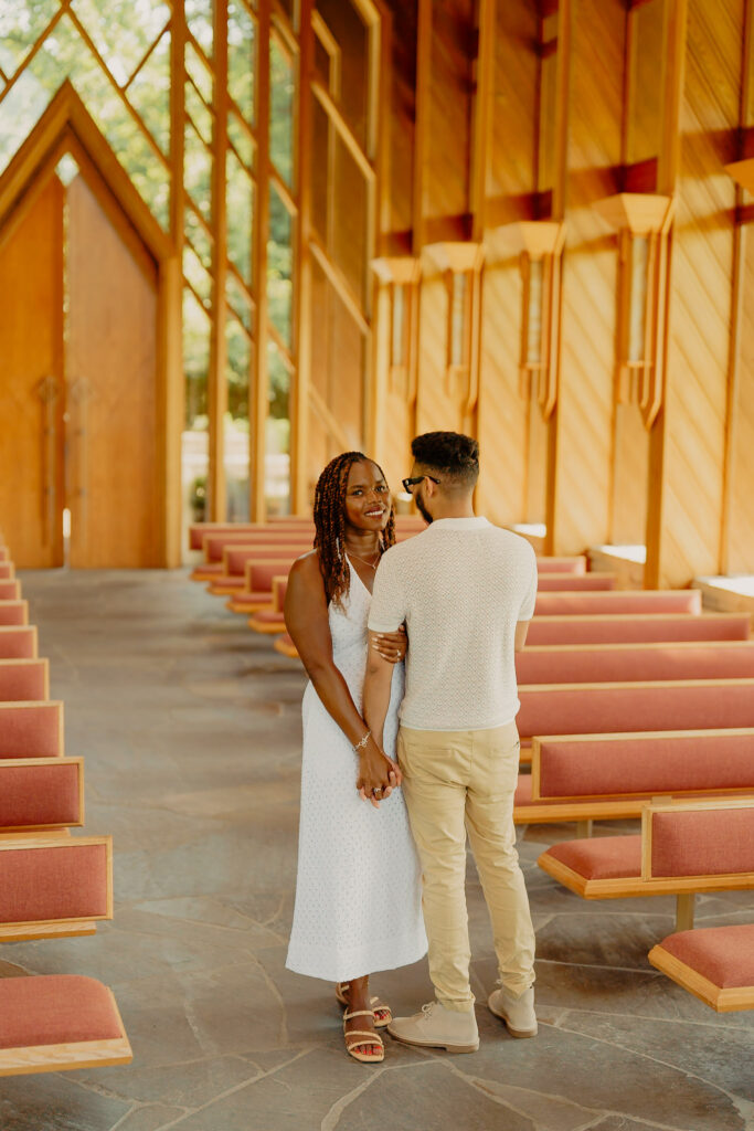 Romantic Powell Gardens couple in pose and woman smiling