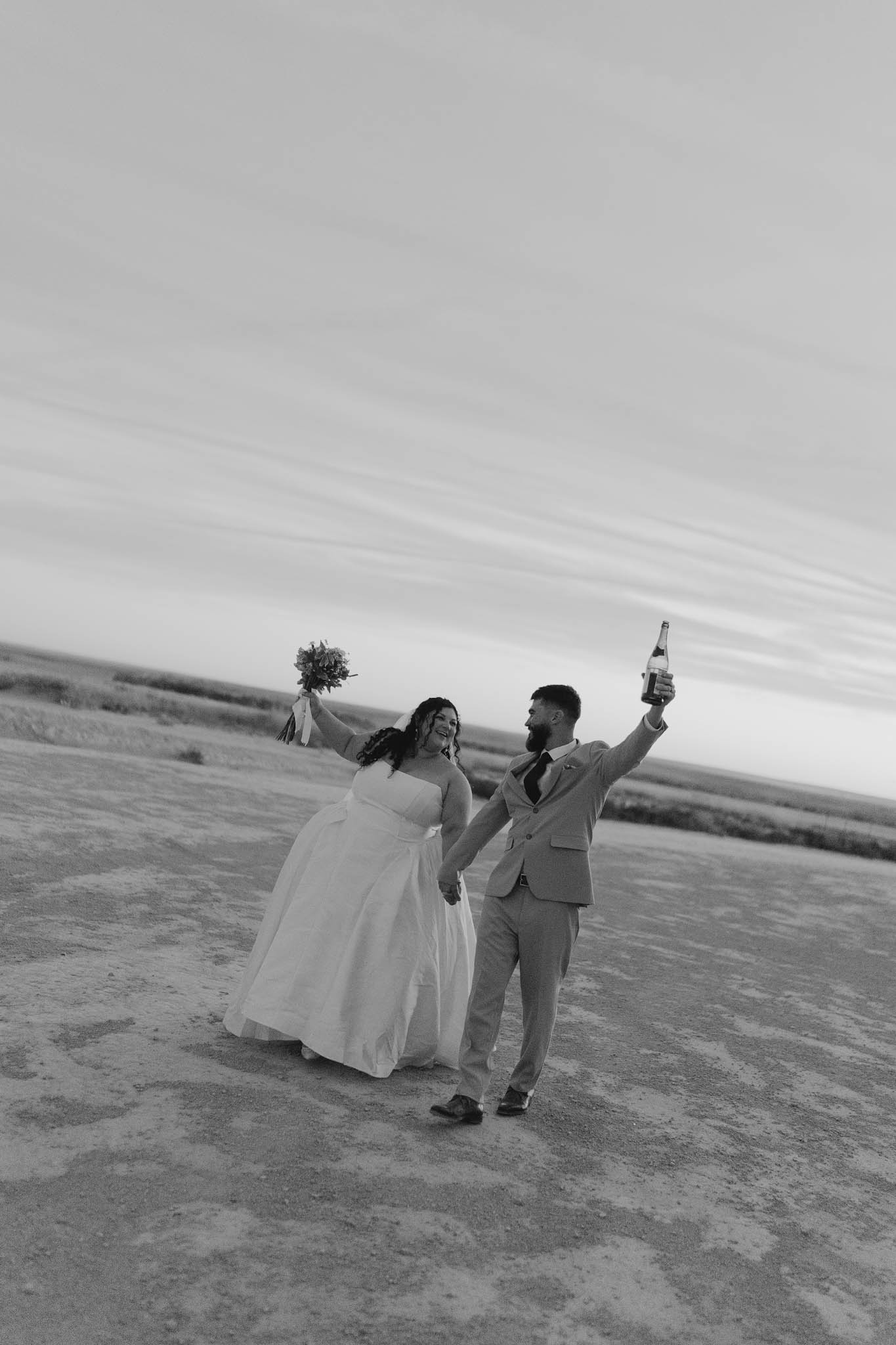 Couple walking together cheerfully while holding hands